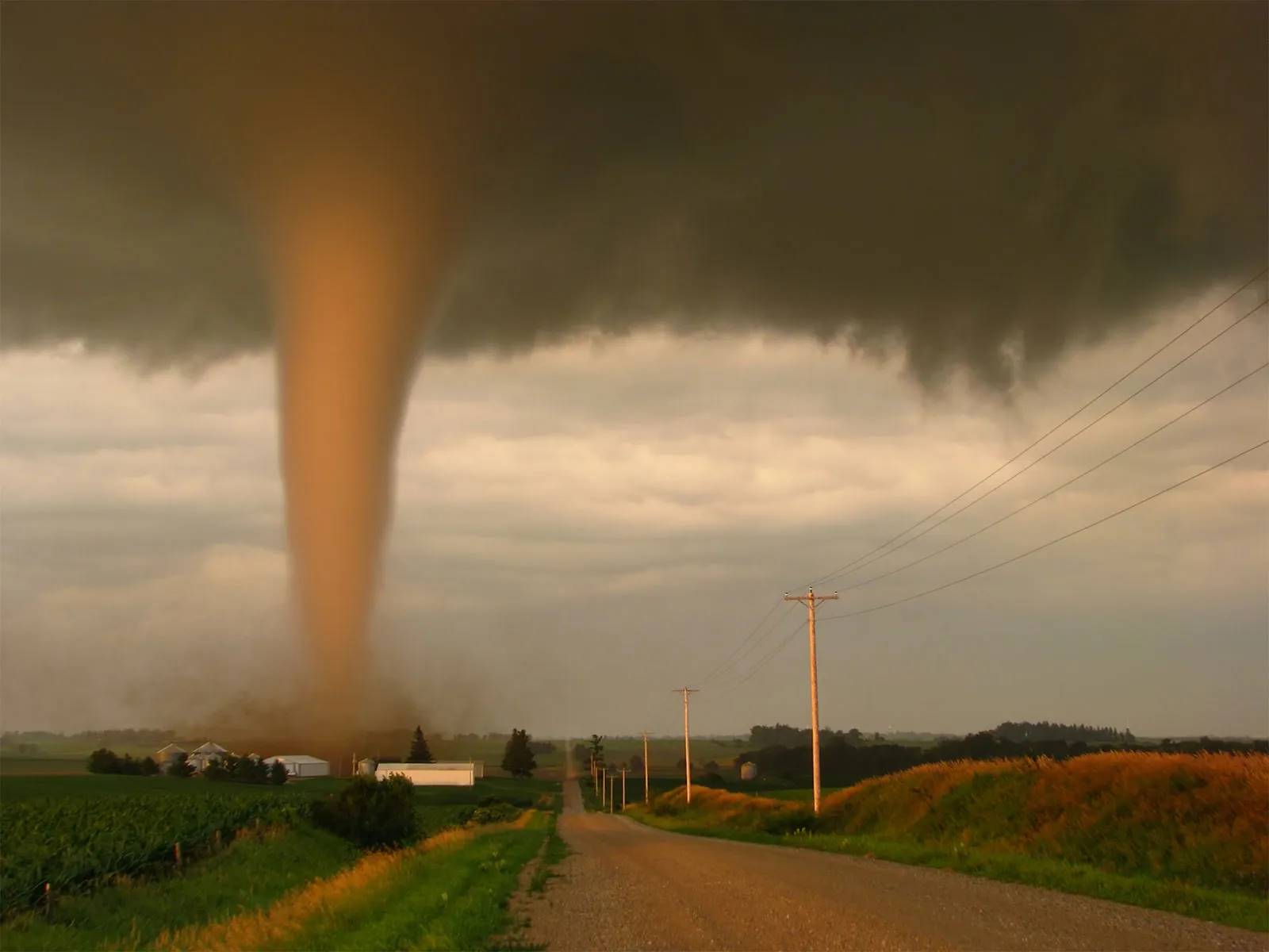 Most tornadoes occur in the United States due to a unique geographic combination: the flat plains of the Midwest provide an open corridor for air masses to meet, while the Rocky Mountains and Gulf of Mexico create the perfect ingredients. Warm, moist air from the Gulf converges with cool, dry air from the north and west, a collision that fuels powerful supercells and tornadoes in a region with few geographical barriers to stop them. Geographical factors Collision of air masses: The central U.S. is a meeting ground for three distinct air masses that are crucial for tornado formation: Warm, moist air from the Gulf of Mexico. Cool, dry air from the Rocky Mountains and Canada. Warm, dry air from the American Southwest. Flat plains: The Great Plains provide a vast, flat area with no major mountain ranges to disrupt the collision of these air masses, allowing for the organized rotation needed for tornadoes to form. Location of mountain ranges: The Rocky Mountains to the west and other mountain ranges act as a "highway" that funnels cold, dry air from the north and west down into the plains, while the Gulf of Mexico provides a steady source of warm, moist air from the south. Meteorological conditions Wind shear: The difference in wind speed and direction between the fast-moving jet stream aloft and the slower, warm winds from the Gulf creates a spinning, horizontal vortex of air. Updrafts: The collision of air masses creates a strong updraft that can tilt the horizontal spinning vortex to a vertical position, creating a rotating storm called a supercell. Supercell storms: A supercell can produce the powerful updrafts and rotating winds necessary for a tornado to form, with about 20% of supercells producing a tornado. How many tornadoes strike the US? How many people died on March 15, 2025? What happened in the USA with the tornado? Where is the tornado in the USA?